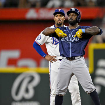 Jul 6, 2024; Arlington, Texas, USA; Tampa Bay Rays left fielder Randy Arozarena (56) hits a double against the Texas Rangers during the third inning at Globe Life Field.