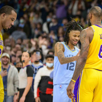 Dec 29, 2021; Memphis, Tennessee, USA; Memphis Grizzlies guard Ja Morant (12) hugs Los Angeles Lakers forward LeBron James (6) after the game at the FedExForum. Mandatory Credit: Jerome Miron-USA TODAY Sports