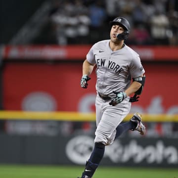 Sep 2, 2024; Arlington, Texas, USA; New York Yankees designated hitter Giancarlo Stanton (27) rounds the bases after he hits a home run against the Texas Rangers during the eighth inning at Globe Life Field. Mandatory Credit: Jerome Miron-USA TODAY Sports