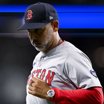 Aug 3, 2024; Arlington, Texas, USA;  Boston Red Sox manager Alex Cora (13) runs back to the dugout during the sixth inning against the Texas Rangers at Globe Life Field. Mandatory Credit: Jerome Miron-USA TODAY Sports