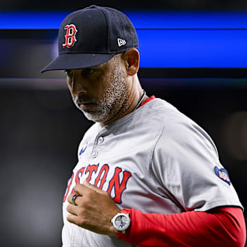 Aug 3, 2024; Arlington, Texas, USA;  Boston Red Sox manager Alex Cora (13) runs back to the dugout during the sixth inning against the Texas Rangers at Globe Life Field. Mandatory Credit: Jerome Miron-Imagn Images