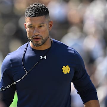 Sep 14, 2024; West Lafayette, Indiana, USA; Notre Dame Fighting Irish head coach Marcus Freeman walks the line of warm ups before a game against the Purdue Boilermakers at Ross-Ade Stadium. Mandatory Credit: Marc Lebryk-Imagn Images