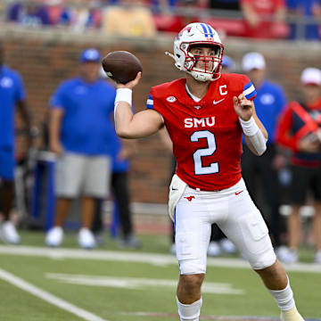 Sep 6, 2024; Dallas, Texas, USA; Southern Methodist Mustangs quarterback Preston Stone (2) passes the ball against the Brigham Young Cougars during the first half at Gerald J. Ford Stadium. Mandatory Credit: Jerome Miron-Imagn Images