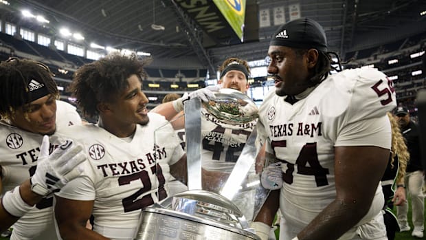 Texas A&M Aggies linebacker Taurean York (21) and linebacker Danny Lockhart Jr. (54) celebrate with the Southwest Classic.