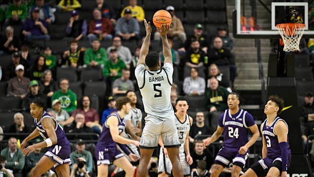 Feb 11, 2025; Eugene, Oregon, USA; Oregon Ducks guard TJ Bamba (5) shoots the ball against the Northwestern Wildcats during t