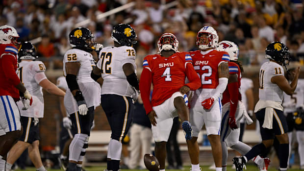SMU defensive tackle Terry Webb (4) celebrates after he sacks East Texas A&M Lions quarterback Eric Rodriguez 