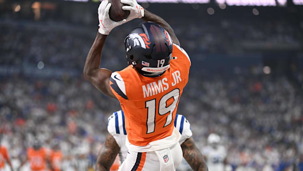 Denver Broncos wide receiver Marvin Mims Jr. (19) receives a pass to score a touchdown vs. the Indianapolis Colts. 