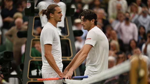 Alexander Zverev and Taylor Fritz speak at the net after their match.