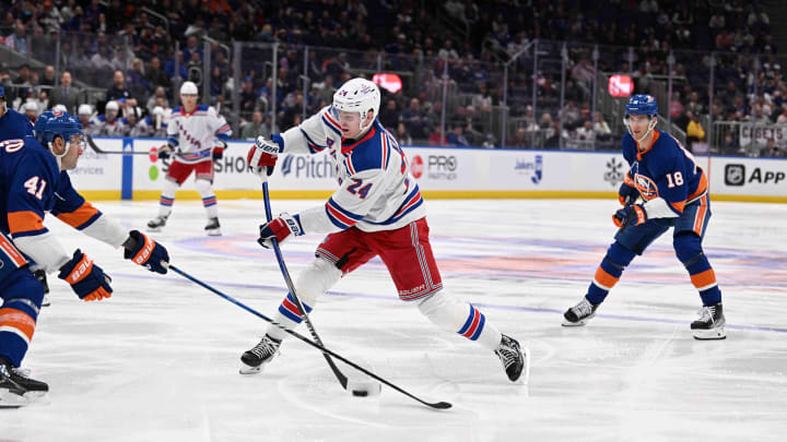 Apr 9, 2024; Elmont, New York, USA; New York Rangers right wing Kaapo Kakko (24) attempts a shot against the New York Islanders during the third period at UBS Arena. Mandatory Credit: Dennis Schneidler-USA TODAY Sports