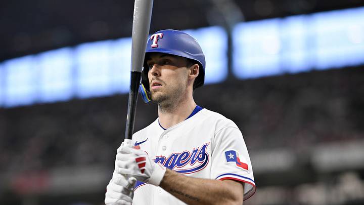 May 9, 2026; Arlington, Texas, USA; Texas Rangers center fielder Evan Carter (32) walks to the on deck circle during the game against the Chicago Cubs at Globe Life Field. Mandatory Credit: Jerome Miron-Imagn Images