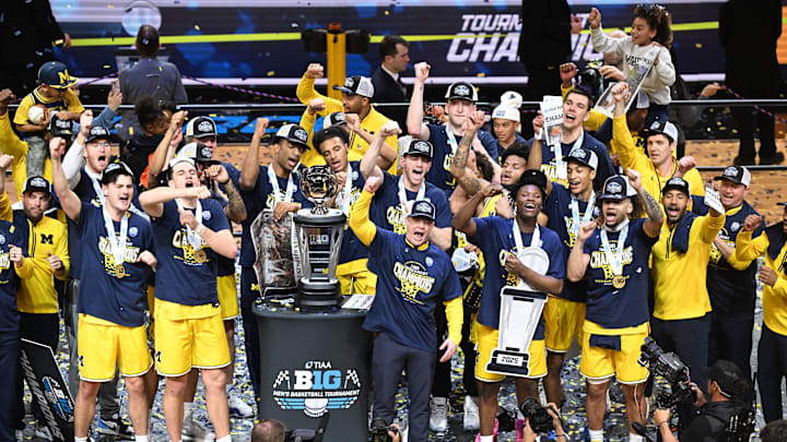 Mar 16, 2025; Indianapolis, IN, USA; The Michigan Wolverines celebrate winning the Big Ten Championship after defeating the Wisconsin Badgers during the 2025 Big Ten Championship Game at Gainbridge Fieldhouse. Mandatory Credit: Robert Goddin-Imagn Images