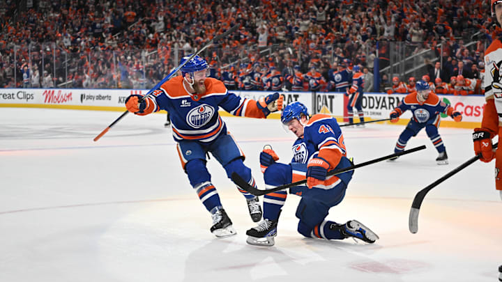 Apr 20, 2026; Edmonton, Alberta, CAN; Edmonton Oilers defenseman Mattias Ekholm (14) and right winger Kasperi Kapanen (42) celebrate a goal on the Anaheim Ducks in game one of the first round of the 2026 Stanley Cup Playoffs during the third period at Rogers Place. Mandatory Credit: Walter Tychnowicz-Imagn Images