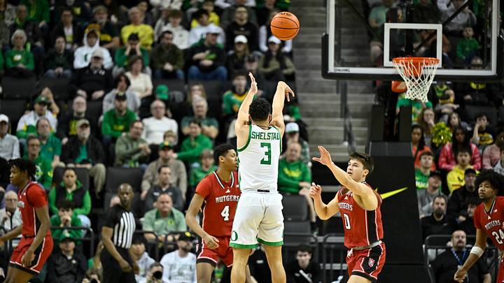 Feb 16, 2025; Eugene, Oregon, USA; Oregon Ducks guard Jackson Shelstad (3) shoots a three-pointer during the second half against the Rutgers Scarlet Knights at Matthew Knight Arena.