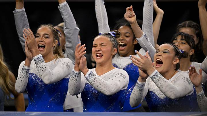  The UCLA Bruins gymnasts celebrate during the 2025 Women's National Gymnastics Semifinal. 