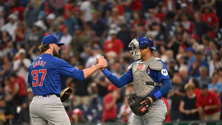 Aug 31, 2024; Washington, District of Columbia, USA; Chicago Cubs relief pitcher Porter Hodge (37) and catcher Christian Bethancourt (60) celebrate after defeating the Washington Nationals at Nationals Park. Mandatory Credit: Rafael Suanes-USA TODAY Sports