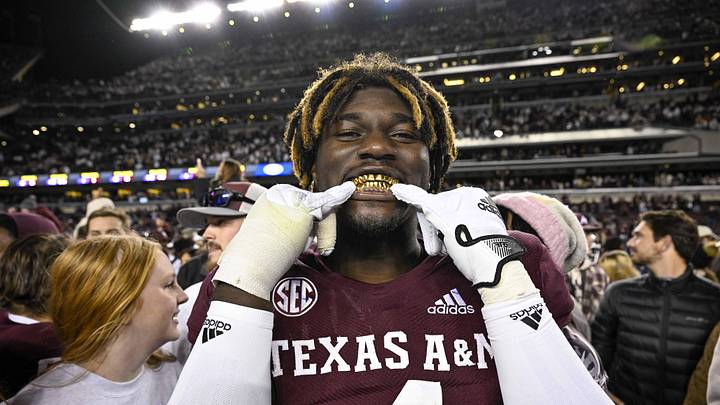 Nov 26, 2022; College Station, Texas, USA; Texas A&M Aggies defensive lineman Shemar Stewart (4) shows off his gold grill smile after the Aggies defeat the LSU Tigers at Kyle Field. Mandatory Credit: Jerome Miron-Imagn Images