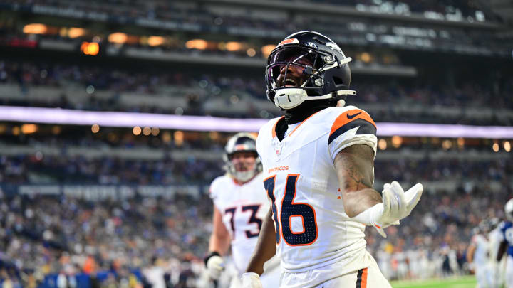 Aug 11, 2024; Indianapolis, Indiana, USA;  Denver Broncos running back Tyler Badie (36) celebrates a touchdown during the second half against the Indianapolis Colts at Lucas Oil Stadium. Mandatory Credit: Marc Lebryk-USA TODAY Sports