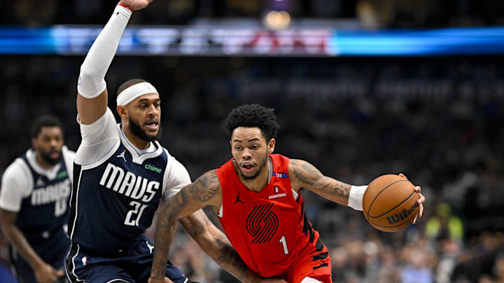 Dec 23, 2024; Dallas, Texas, USA; Portland Trail Blazers guard Anfernee Simons (1) drives to the basket past Dallas Mavericks center Daniel Gafford (21) during the second quarter at the American Airlines Center. Mandatory Credit: Jerome Miron-Imagn Images Dec 23, 2024; Dallas, Texas, USA; Portland Trail Blazers guard Anfernee Simons (1) drives to the basket past Dallas Mavericks center Daniel Gafford (21) during the second quarter at the American Airlines Center. Mandatory Credit: Jerome Miron-Imagn Images