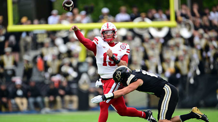 Sep 28, 2024; West Lafayette, Indiana, USA; Purdue Boilermakers linebacker Yanni Karlaftis (14) pressures Nebraska Cornhuskers quarterback Dylan Raiola (15) during the first quarter at Ross-Ade Stadium. Sep 28, 2024; West Lafayette, Indiana, USA; Purdue Boilermakers linebacker Yanni Karlaftis (14) pressures Nebraska Cornhuskers quarterback Dylan Raiola (15) during the first quarter at Ross-Ade Stadium.