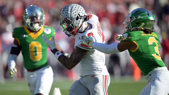 Jan 1, 2025; Pasadena, CA, USA; Ohio State Buckeyes wide receiver Emeka Egbuka (2) runs against Oregon Ducks defensive back Brandon Johnson (3) in the first quarter during the 2025 Rose Bowl college football quarterfinal game at Rose Bowl Stadium. Jan 1, 2025; Pasadena, CA, USA; Ohio State Buckeyes wide receiver Emeka Egbuka (2) runs against Oregon Ducks defensive back Brandon Johnson (3) in the first quarter during the 2025 Rose Bowl college football quarterfinal game at Rose Bowl Stadium.