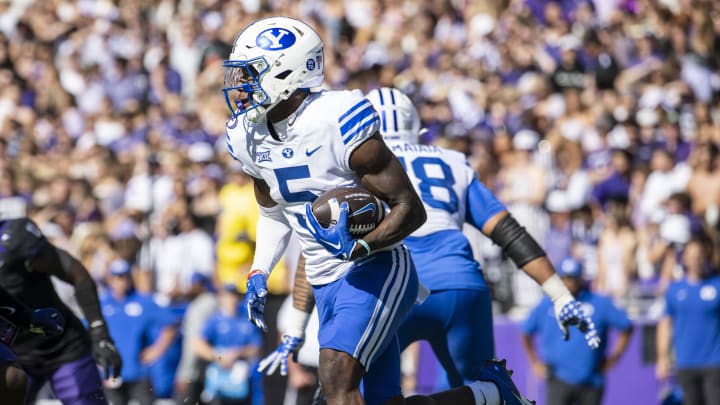 Oct 14, 2023; Fort Worth, Texas, USA; Brigham Young Cougars wide receiver Darius Lassiter (5) runs with the ball against the TCU Horned Frogs during the game at Amon G. Carter Stadium.