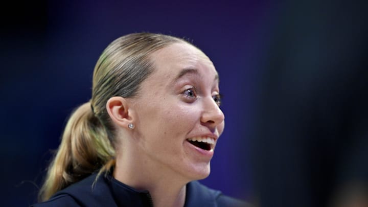 Dallas Wings guard Paige Bueckers laughs with her teammates during the second half against the New York Liberty. Dallas Wings guard Paige Bueckers laughs with her teammates during the second half against the New York Liberty.
