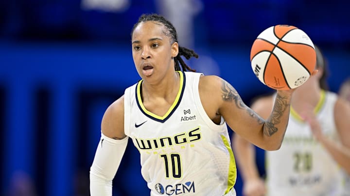 Dallas Wings guard Aziaha James brings the ball up court against the Connecticut Sun. Dallas Wings guard Aziaha James brings the ball up court against the Connecticut Sun.
