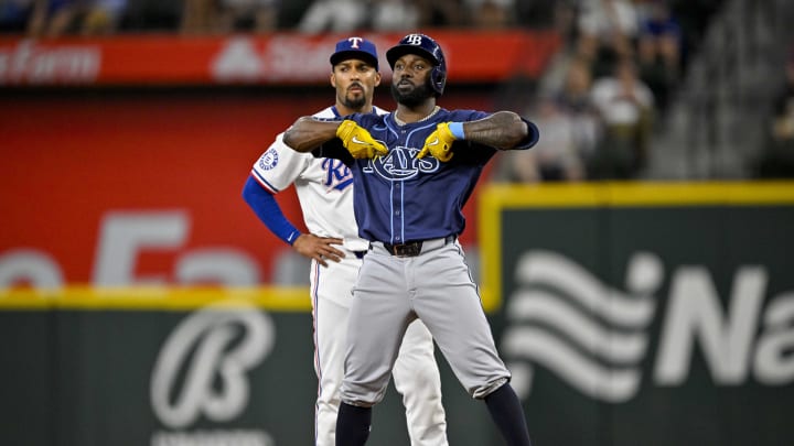 Jul 6, 2024; Arlington, Texas, USA; Tampa Bay Rays left fielder Randy Arozarena (56) hits a double against the Texas Rangers during the third inning at Globe Life Field.