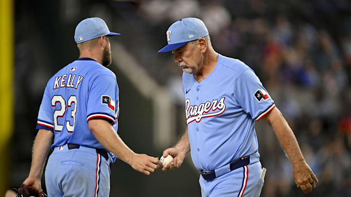 Sep 21, 2025; Arlington, Texas, USA; Texas Rangers manager Bruce Bochy (15) takes the ball from starting pitcher Merrill Kelly (23) as Kelly leaves the game against the Miami Marlins during the fifth inning at Globe Life Field. 