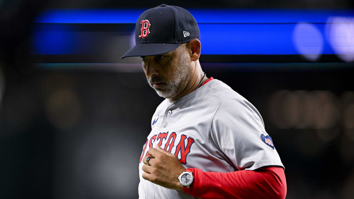 Aug 3, 2024; Arlington, Texas, USA;  Boston Red Sox manager Alex Cora (13) runs back to the dugout during the sixth inning against the Texas Rangers at Globe Life Field. Mandatory Credit: Jerome Miron-USA TODAY Sports