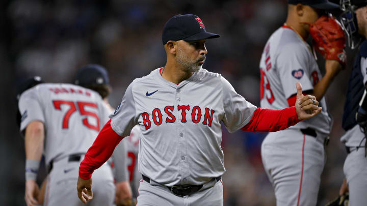 Aug 3, 2024; Arlington, Texas, USA;  Boston Red Sox manager Alex Cora (13) gives a thumbs up to the umpire during the sixth inning against the Texas Rangers at Globe Life Field. Mandatory Credit: Jerome Miron-USA TODAY Sports