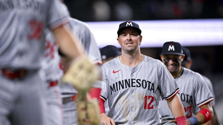 Minnesota Twins second baseman Kyle Farmer (12) and the Twins celebrate the win over the Texas Rangers at Globe Life Field in Arlington, Texas, on Aug. 15, 2024.