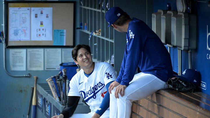 Los Angeles Dodgers designated hitter Shohei Ohtani talks with starting pitcher Yoshinobu Yamamoto in the dugout during a July 2024 game against the San Francisco Giants at Dodger Stadium. Los Angeles Dodgers designated hitter Shohei Ohtani talks with starting pitcher Yoshinobu Yamamoto in the dugout during a July 2024 game against the San Francisco Giants at Dodger Stadium.