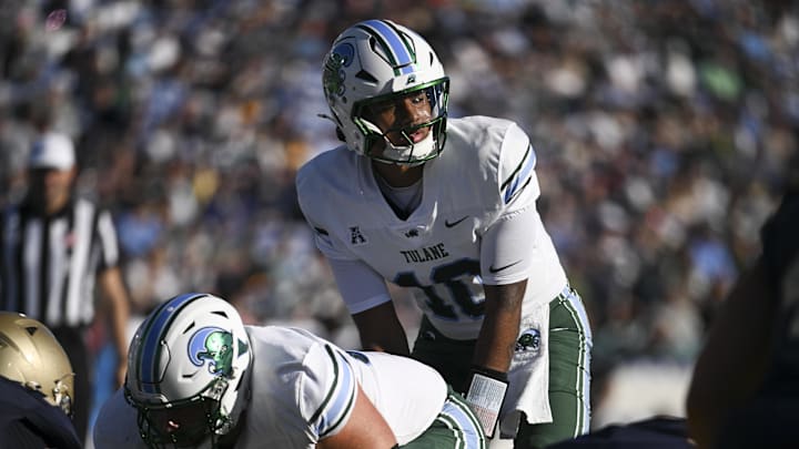 Nov 16, 2024; Annapolis, Maryland, USA; Tulane Green Wave quarterback Darian Mensah (10) calls a play at the line during the second half  against the Navy Midshipmen at Navy-Marine Corps Memorial Stadium. Mandatory Credit: Tommy Gilligan-Imagn Images