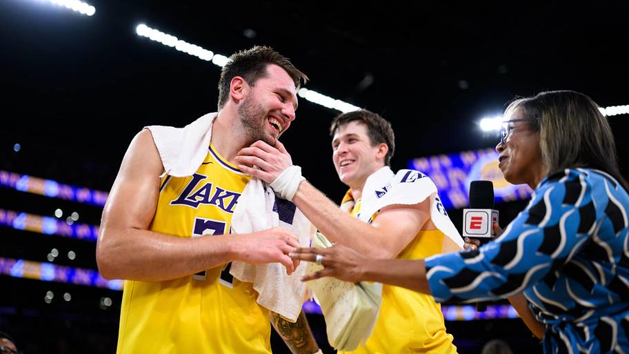 Los Angeles Lakers guard Luka Dončić reacts with guard Austin Reaves after scoring a game winning shot.