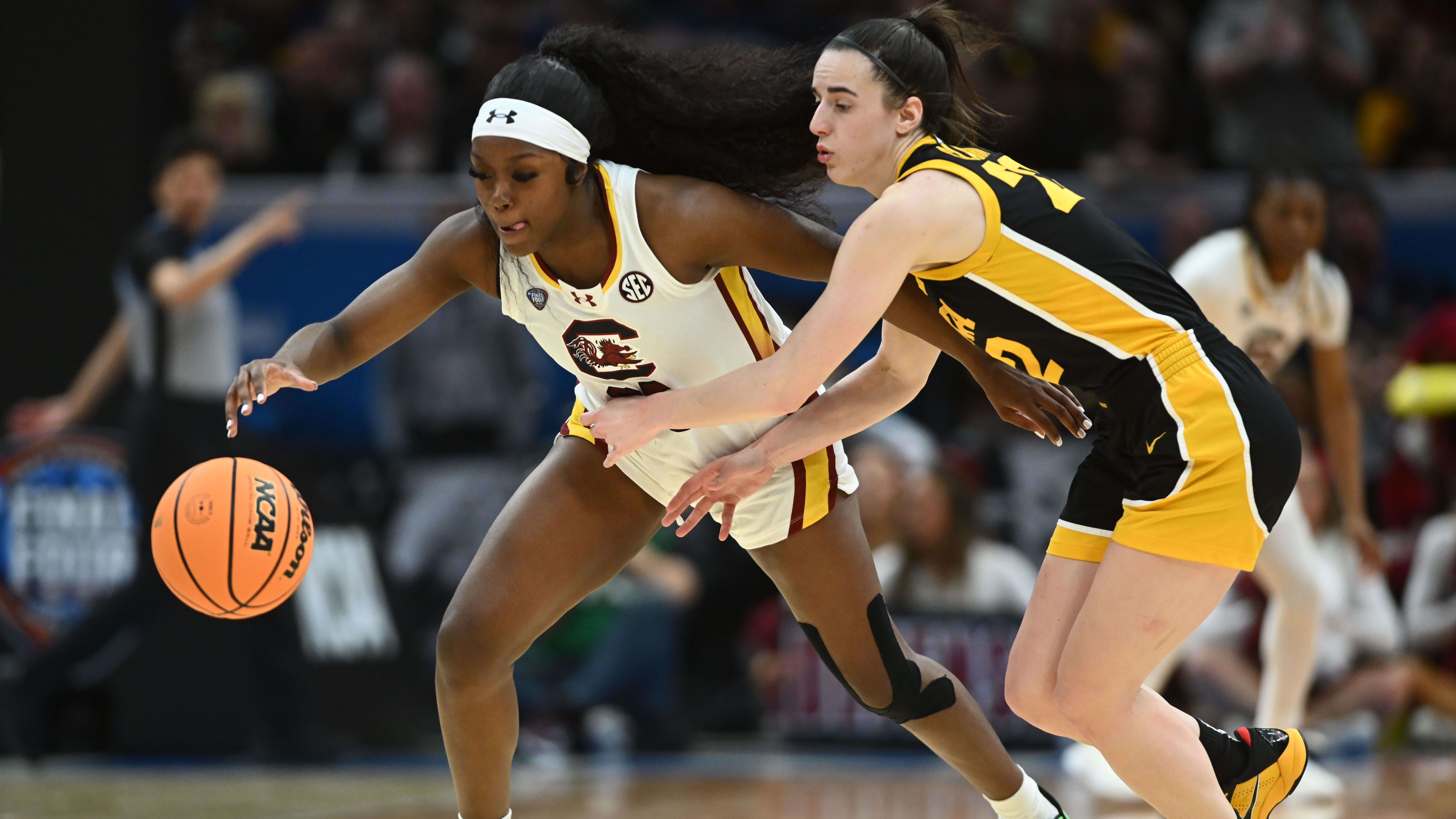 Johnson steals the ball from Clark during Sunday’s women’s national championship game.