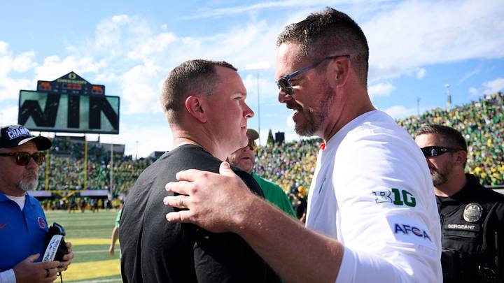 Sep 5, 2026; Eugene, Oregon, USA; Boise State Broncos head coach Spencer Danielson and Oregon Ducks head coach Dan Lanning embrace after a game at Autzen Stadium. Mandatory Credit: Troy Wayrynen-Imagn Images