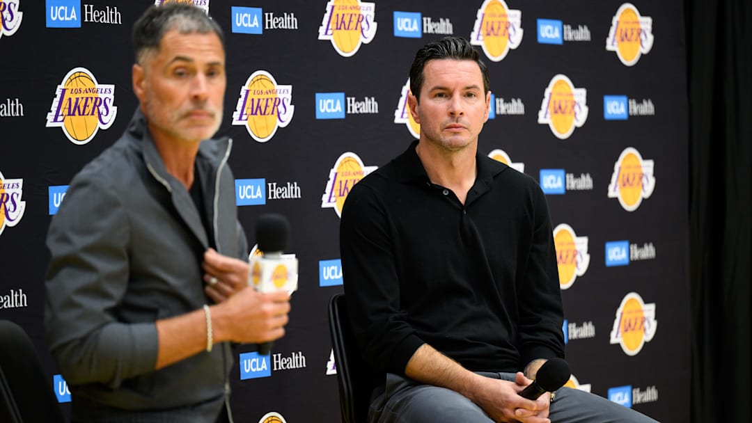 Los Angeles Lakers head coach JJ Redick, right, speaks during a press conference to preview the 2025-26 season at UCLA Health Training Center.