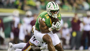 Nov 14, 2025; Eugene, Oregon, USA; Oregon Ducks tight end Kenyon Sadiq (18) catches a pass during the first half against Minnesota Golden Gophers defensive back Kerry Brown (14) at Autzen Stadium. Mandatory Credit: Troy Wayrynen-Imagn Images