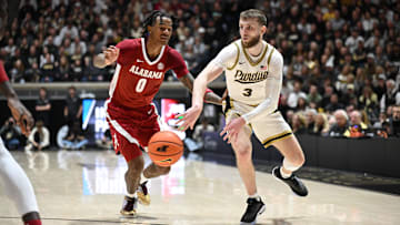 Nov 15, 2024; West Lafayette, Indiana, USA; Purdue Boilermakers guard Braden Smith (3) passes the ball around Alabama Crimson Tide guard Labaron Philon (0) during the second half at Mackey Arena. Mandatory Credit: Marc Lebryk-Imagn Images
