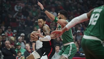 Mar 23, 2025; Portland, Oregon, USA;  Portland Trail Blazers guard Anfernee Simons (1) dribbles the ball during the first half against Boston Celtics forward Jayson Tatum (0) at Moda Center. Mandatory Credit: Troy Wayrynen-Imagn Images