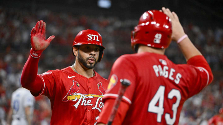 Aug 16, 2024; St. Louis, Missouri, USA;  St. Louis Cardinals left fielder Tommy Pham (29) is congratulated by catcher Pedro Pages (43) after scoring against the Los Angeles Dodgers during the sixth inning at Busch Stadium. Mandatory Credit: Jeff Curry-USA TODAY Sports