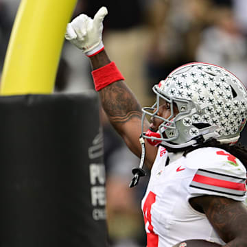 Nov 8, 2025; West Lafayette, Indiana, USA; Ohio State Buckeyes wide receiver Jeremiah Smith (4) celebrates after scoring a touchdown during the second quarter against the Purdue Boilermakers at Ross-Ade Stadium. Mandatory Credit: Marc Lebryk-Imagn Images