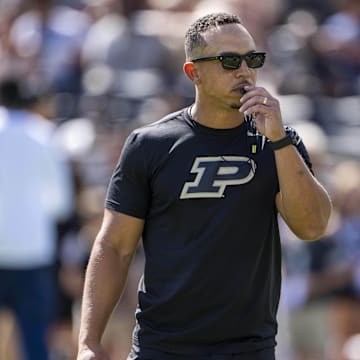 Purdue Boilermakers head coach Ryan Walters walks on the field 