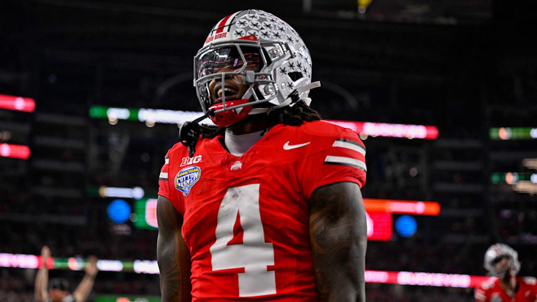 Dec 31, 2025; Arlington, TX, USA; Ohio State Buckeyes wide receiver Jeremiah Smith (4) celebrates after he runs for a touchdown during the 2025 Cotton Bowl.