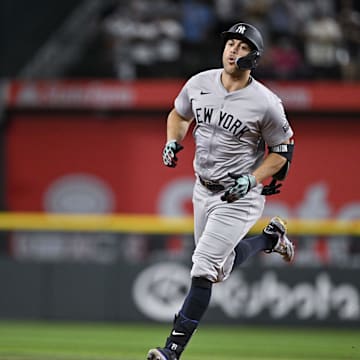 Sep 2, 2024; Arlington, Texas, USA; New York Yankees designated hitter Giancarlo Stanton (27) rounds the bases after he hits a home run against the Texas Rangers during the eighth inning at Globe Life Field.