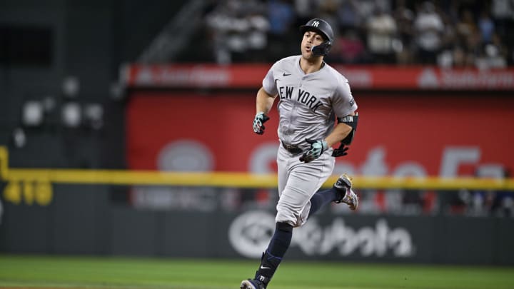 Sep 2, 2024; Arlington, Texas, USA; New York Yankees designated hitter Giancarlo Stanton (27) rounds the bases after he hits a home run against the Texas Rangers during the eighth inning at Globe Life Field.