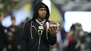 Nov 14, 2025; Eugene, Oregon, USA; Oregon Ducks wide receiver Dakorien Moore (1) watches teammates warm up before a game against the Minnesota Golden Gophers at Autzen Stadium. Mandatory Credit: Troy Wayrynen-Imagn Images