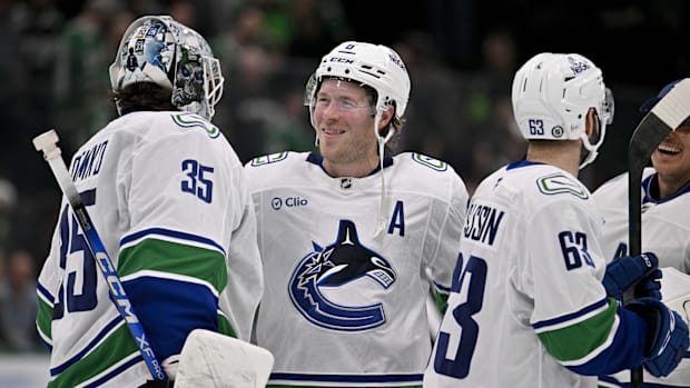 Vancouver Canucks goalie Thatcher Demko and forward Brock Boeser
