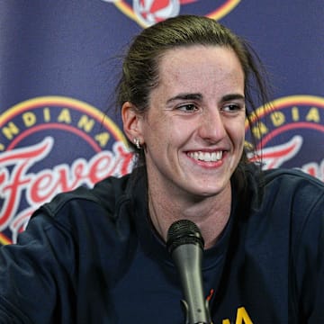 Indiana Fever guard Caitlin Clark (22) answers questions before the preseason game against the Brazil National Team at Carver-Haweye Arena.